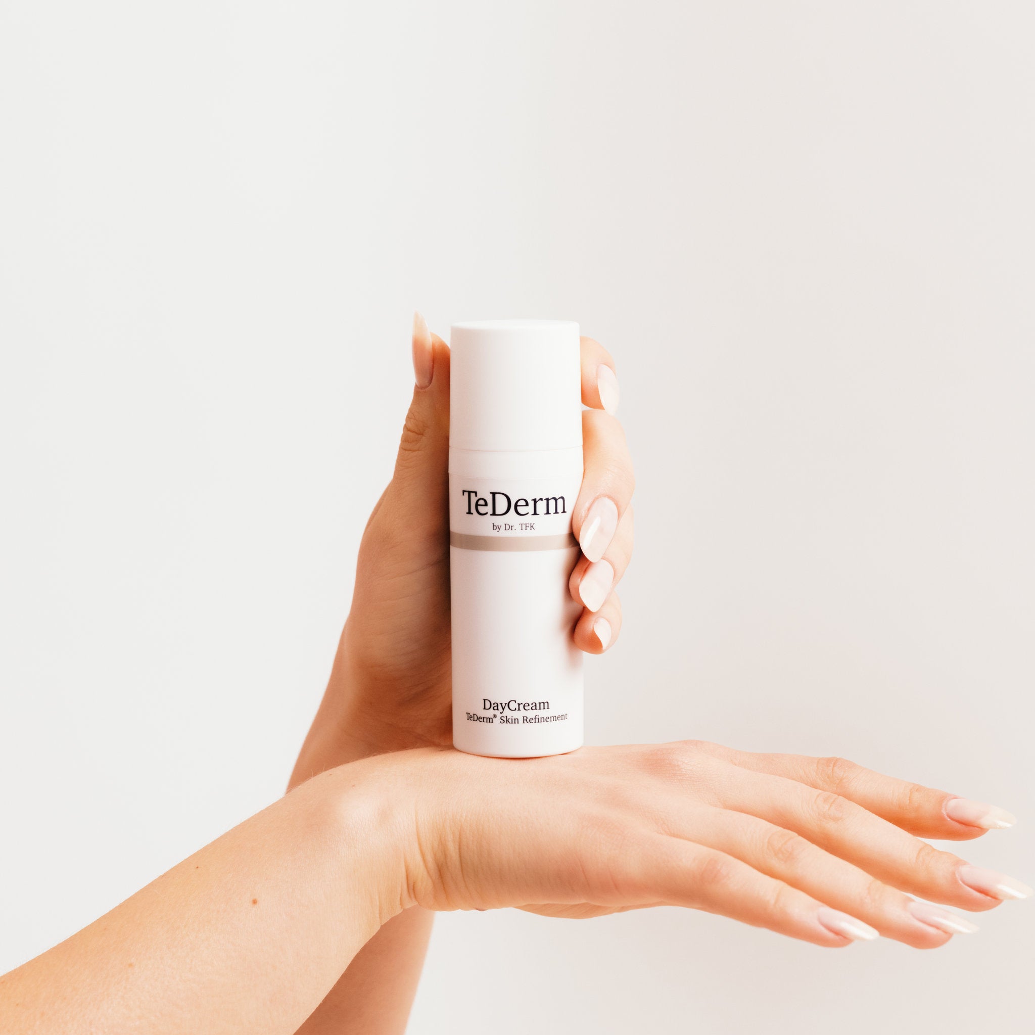Hands holding TeDerm DayCream - daily facial care